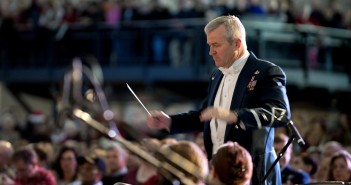 Stock photo of an older white man conducting a military orchestra