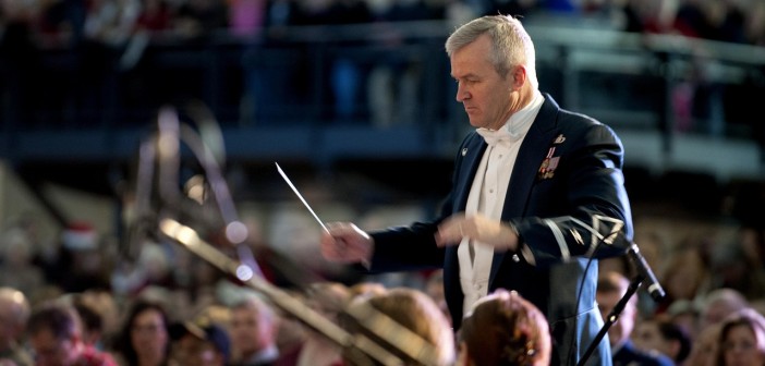 Stock photo of an older white man conducting a military orchestra