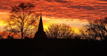 Stock photo of a silhouette of a church in a sunset