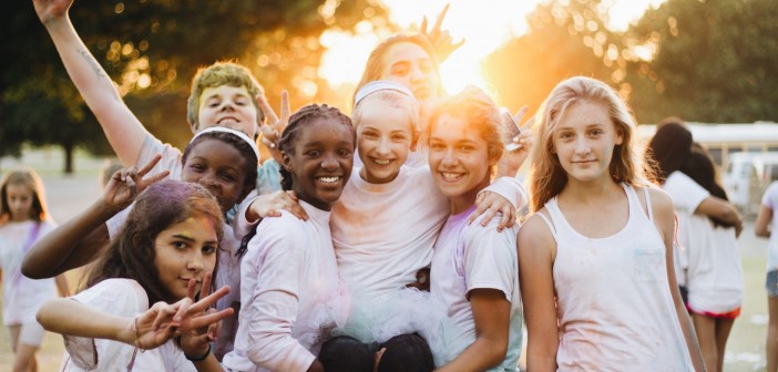 Stock photo of a diverse group of adolescents posing for a picture
