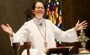 Stock photo of a woman presiding over communion