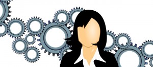 Clip art of a woman with a bunch of gears behind her