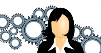 Clip art of a woman with a bunch of gears behind her