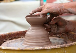 Stock photo of someone crafting something on a potter's wheel
