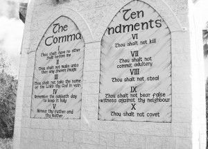Stock photo of the Ten Commandments engraved into a stone wall