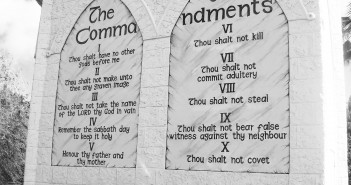 Stock photo of the Ten Commandments engraved into a stone wall