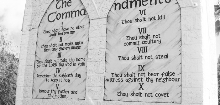 Stock photo of the Ten Commandments engraved into a stone wall