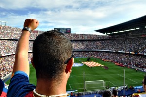 Stock photo of a man cheering at a sporting event