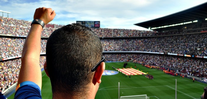 Stock photo of a man cheering at a sporting event