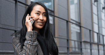 Female pastor speaking on her cell phone