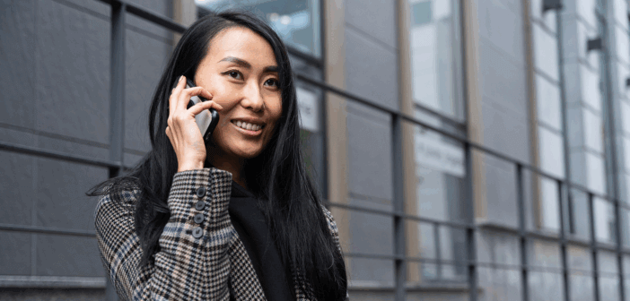 Female pastor speaking on her cell phone