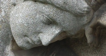 Closeup stock photo of a fairly eroded statue