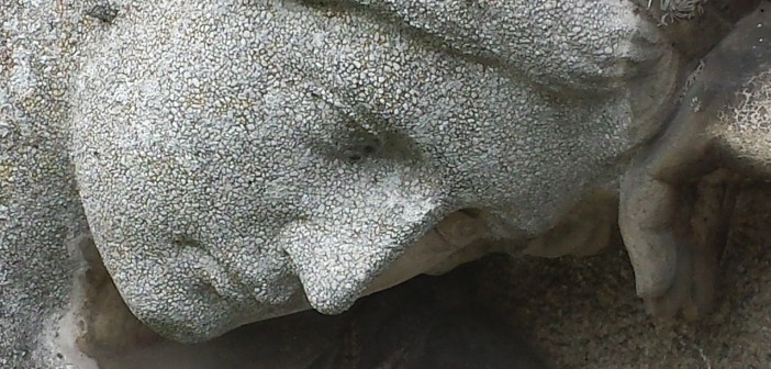 Closeup stock photo of a fairly eroded statue