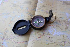 Stock photo of a field compass laying on top of a map