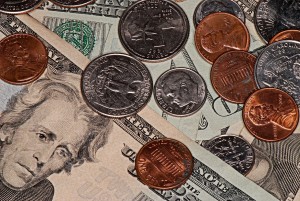 Stock photo of a pile of money in assorted bills and coins
