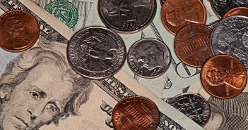 Stock photo of a pile of money in assorted bills and coins