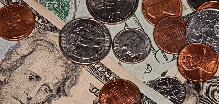 Stock photo of a pile of money in assorted bills and coins