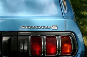 Stock photo of a closeup of the rear-passenger side of a sky-blue Toyota