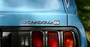 Stock photo of a closeup of the rear-passenger side of a sky-blue Toyota