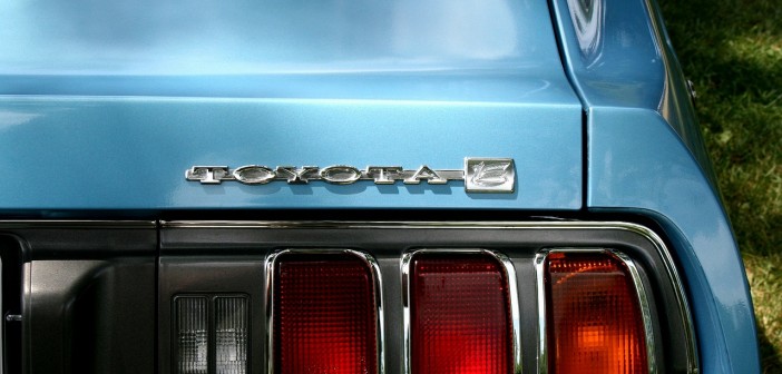 Stock photo of a closeup of the rear-passenger side of a sky-blue Toyota