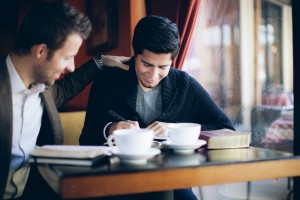 Stock photo of two young men at a coffee shop