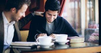 Stock photo of two young men at a coffee shop