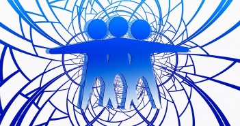 Clip art of three androgynous individuals embracing each other amidst an abstract representation of conflict