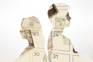 Clip art of a male and female silhouette profile with images of money in the silhouette