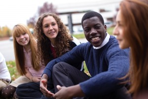 Stock photo of a mixed gender and race group of youth in fellowship outside