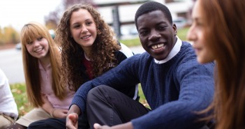 Stock photo of a mixed gender and race group of youth in fellowship outside