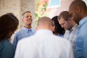 Stock photo of a diverse group of people praying
