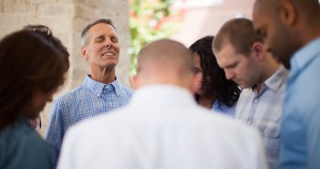 Stock photo of a diverse group of people praying