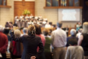 Stock photo of a group of people worshipping together