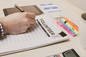 Stock photo of someone signing up to volunteer