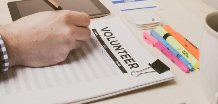 Stock photo of someone signing up to volunteer