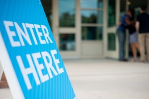 Stock photo of a sign that says "ENTER HERE"