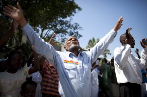 Stock photo of a group of African Americans worshiping outside