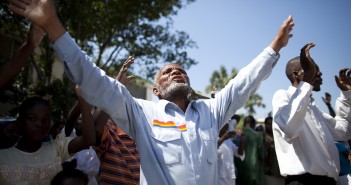 Stock photo of a group of African Americans worshiping outside