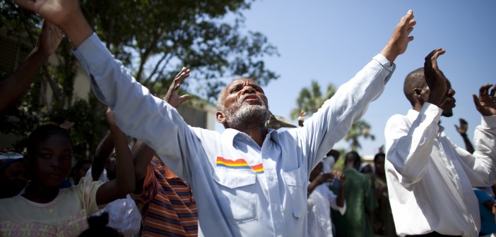 Stock photo of a group of African Americans worshiping outside