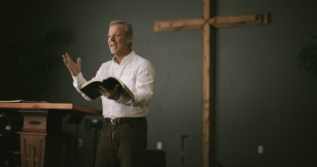 Stock art of an older white man preaching