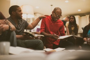 Stock photo of a group of young African Americans hanging out in a lounge