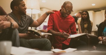 Stock photo of a group of young African Americans hanging out in a lounge