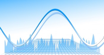 Clip art of a sine curve on top of a coordinate plane with a line graph in the background