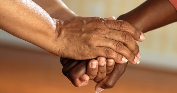 Stock photo of three African American hands on top of each other