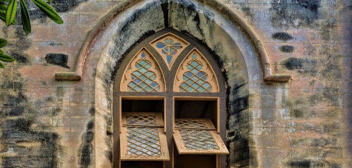 Stock photo of the exterior of a church with its windows open