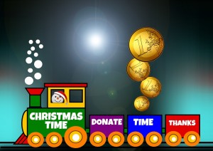 Clip art of a toy train. The front engine is green and conducted by a snowman wearing santa hat and says "Christmas Time". The second car is purple and says "Donate". The third car is blue and says "Time" and it has four coins being dropped into it. The last car is read and says "Thanks"