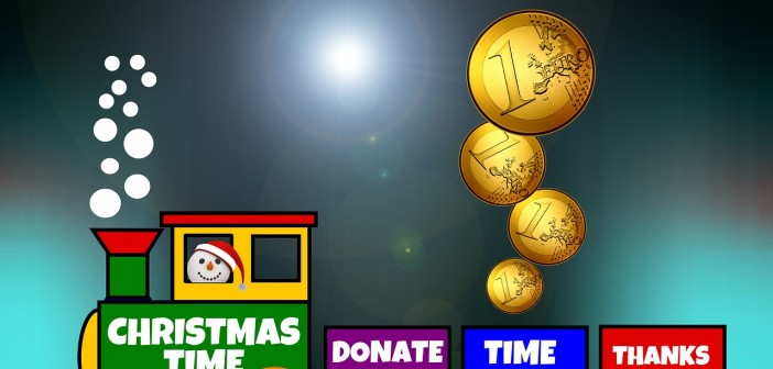 Clip art of a toy train. The front engine is green and conducted by a snowman wearing santa hat and says "Christmas Time". The second car is purple and says "Donate". The third car is blue and says "Time" and it has four coins being dropped into it. The last car is read and says "Thanks"