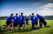 Stock photo of a group of young male soccer players in a huddle