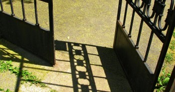 Stock photo of a wrought iron gate that is open