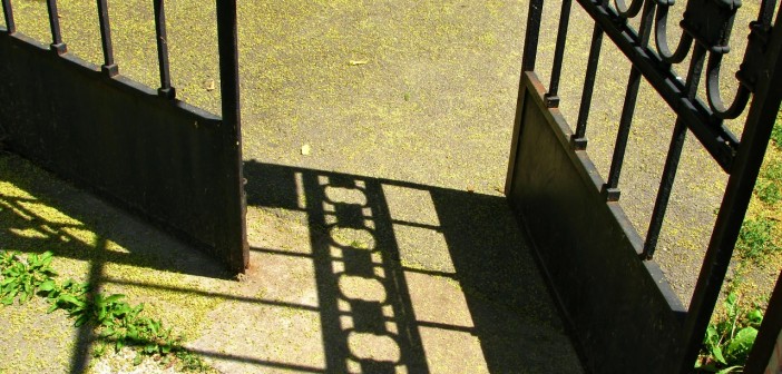 Stock photo of a wrought iron gate that is open